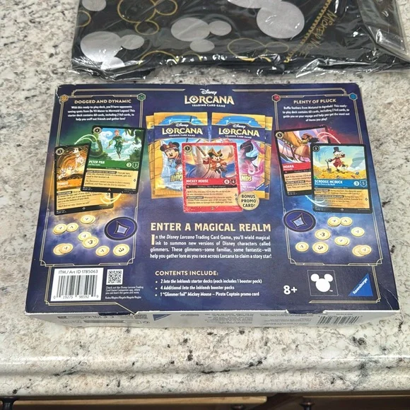 Disney Lorcana Gift Set with Black and Gold Tote and stitch figural bag clips.